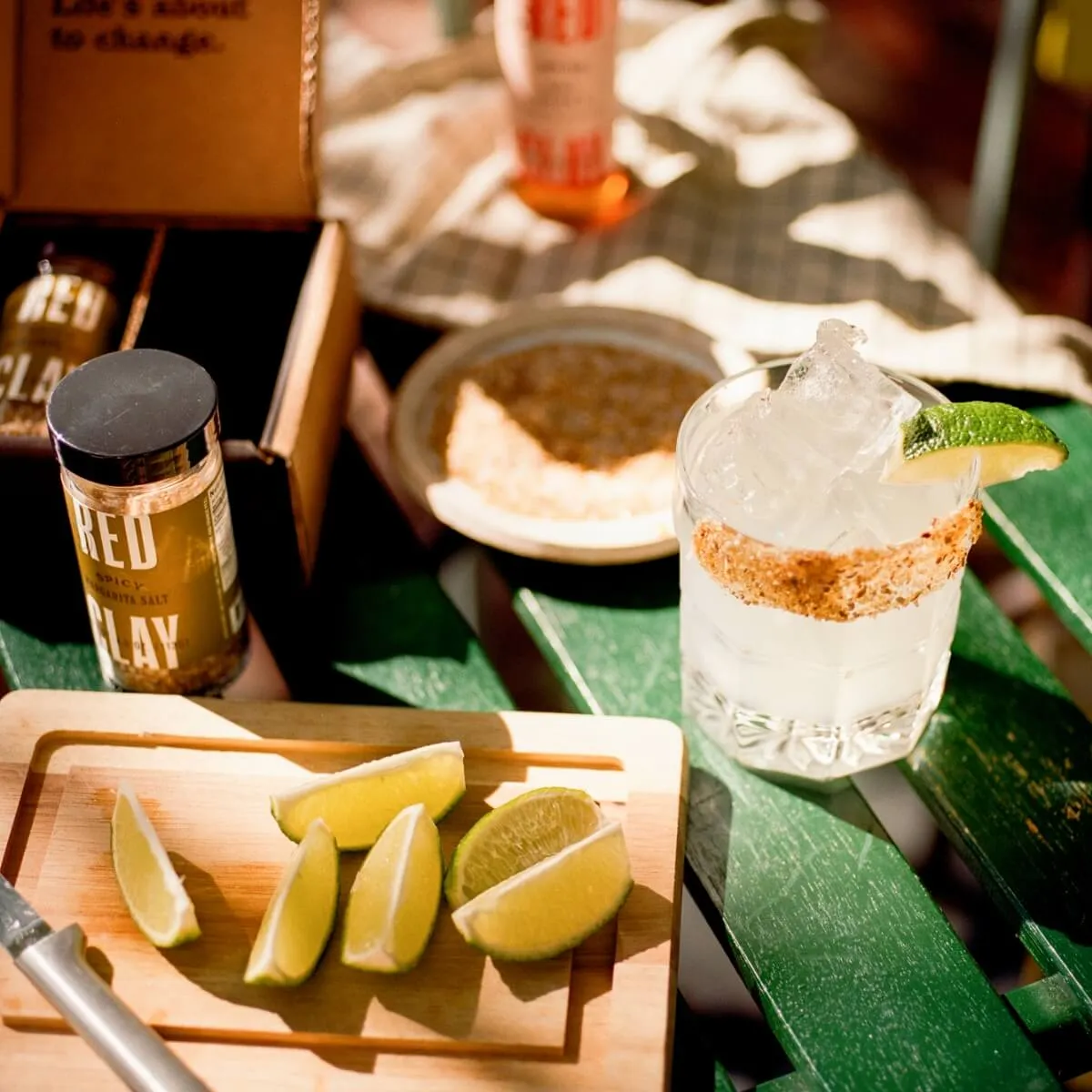 Red Clay pantry products beside a margarita and limes